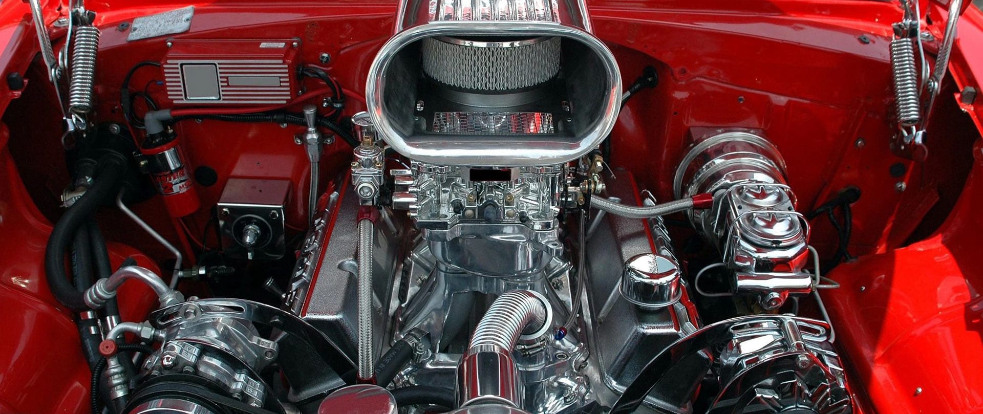 Close-up of a clean muscle car engine with a blower