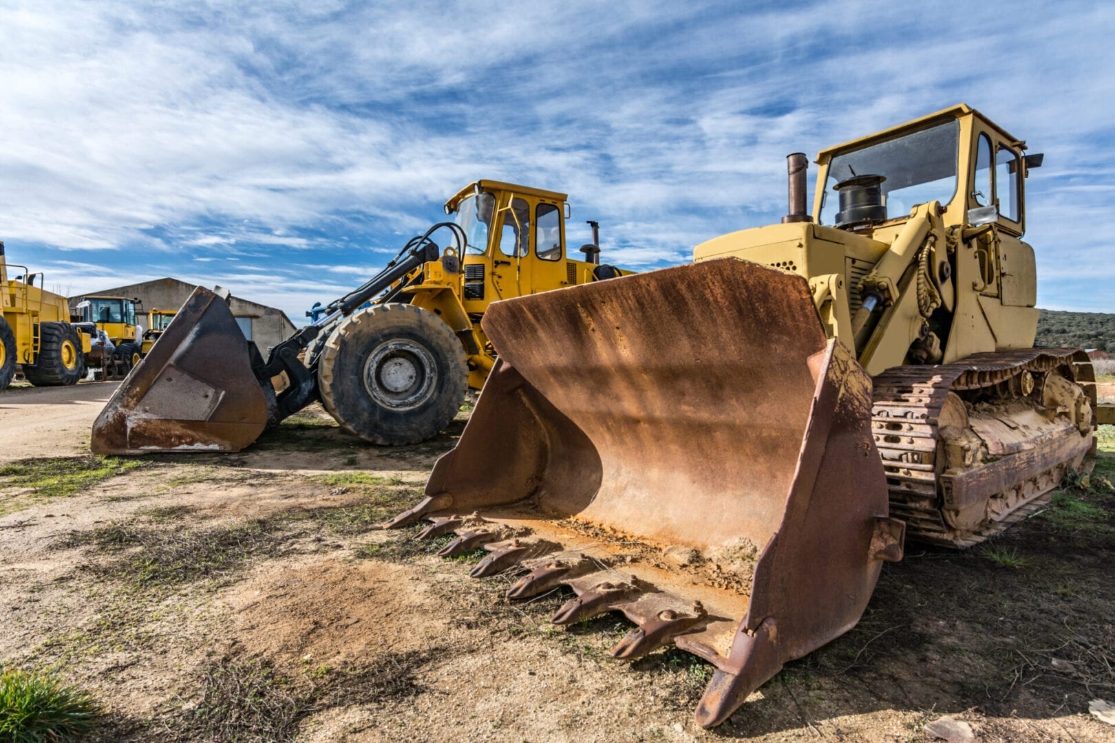 Bulldozer and front-end loader on a construction site.