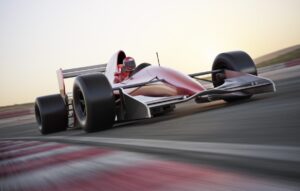 red race car driving on track