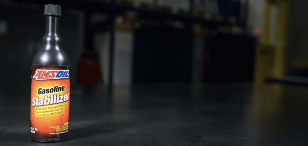 Bottle of AMSOIL Gasoline Stabilizer with black background