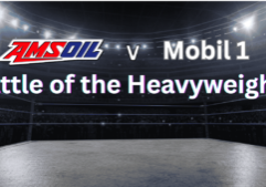 AMSOIL vs. Mobil 1 Battle of the Heavyweights promotional graphic showing a wrestling ring under bright arena lights